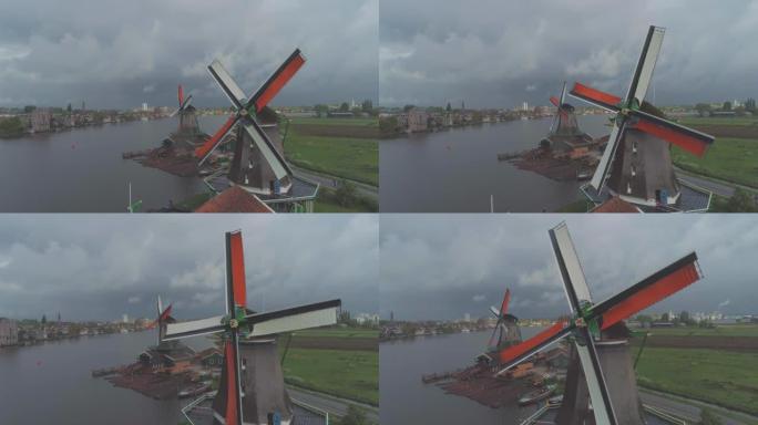 空中接近传统历史荷兰风车的彩色叶片，位于荷兰荷兰北部的Zaanse Schans荷兰可持续清洁能源旅