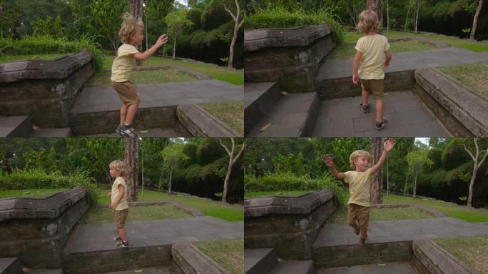 一个小男孩跳跃并进行180度旋转的慢动作镜头