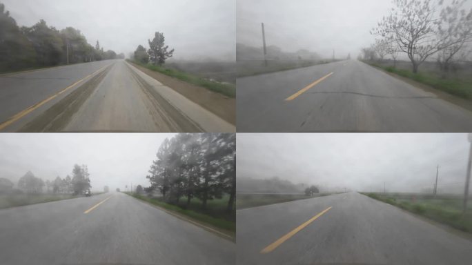 大雾天开车行驶在农村道路