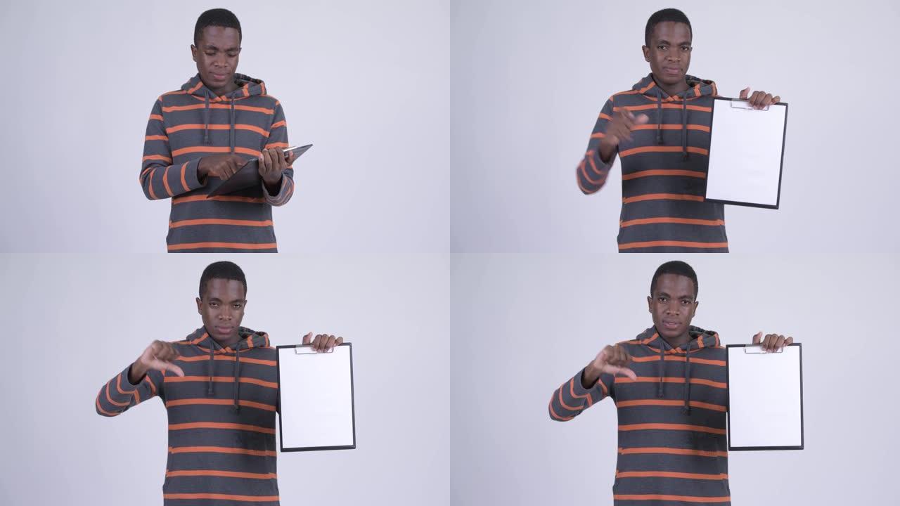 强调年轻的非洲男子展示剪贴板