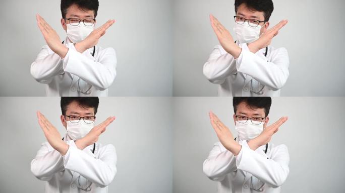 慢动作。一位中年亚洲医生举手表示不赞成。
