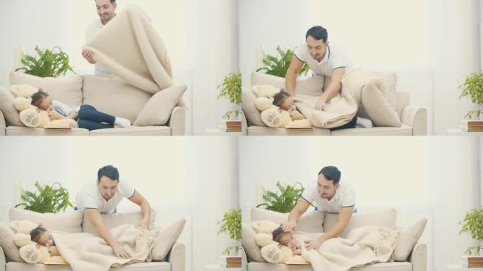 4k视频，有爱心的爸爸用毯子盖住他的小女儿，抚摸她。