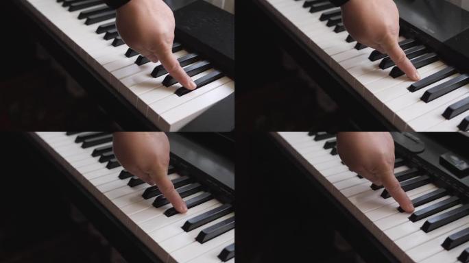 电子琴。手指按下钢琴键。音乐课。