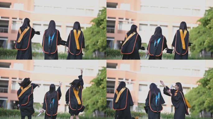 一位从大学毕业的亚洲女毕业生微笑着祝贺她毕业于大学。