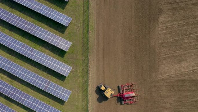 新老农作播种机与太阳能发电场并驾齐驱