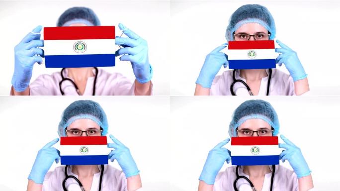 特写。戴眼镜的医生，蓝色医疗帽，手套手持带有巴拉圭国旗的医用口罩。医生护理，冠状病毒期间国家保护，全
