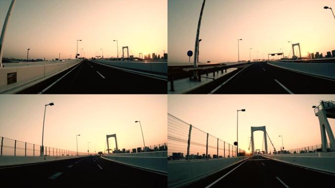 在高速公路/日落/彩虹桥上行驶