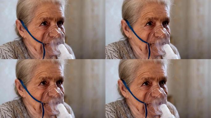 老年妇女用雾化器吸入的程序。