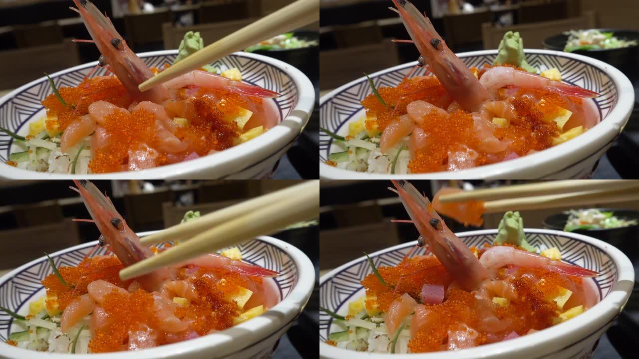 三文鱼生鱼片日本食物虾用筷子吃