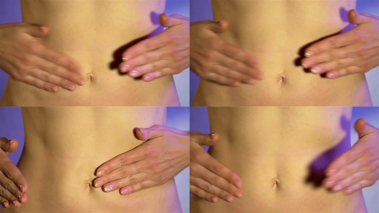 女人用手拍打腹部，皮下脂肪的波浪散开。健康食品和生活方式的概念