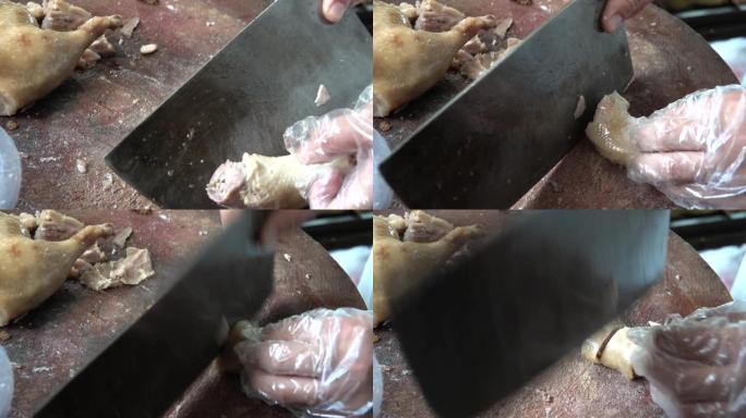 中国餐厅的厨师正在切烤北京烤鸭。中国北京