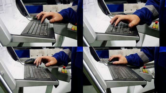 员工在车间使用绘图和控制面板