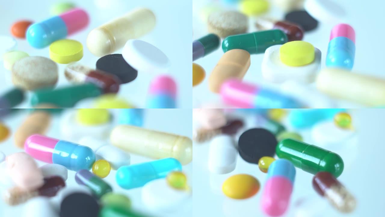 多莉在白色背景上移动五颜六色的各种药丸和药物。