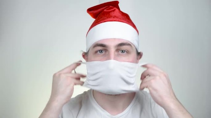 圣诞老人在保护医疗面具在滑稽像素太阳镜在白色的背景。Covid Party时间，新年快乐，检疫圣诞快