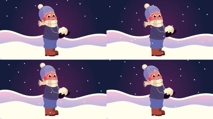 穿着冬装的小男孩在雪景夜景中玩雪球