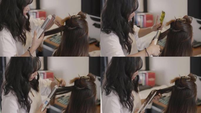 姐姐在家做头发妹妹的头发，他们俩都很开心。