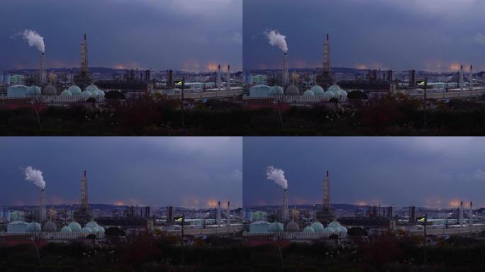 黄昏时炼油厂的景色。石油和天然气工业