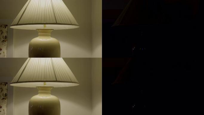 打开卧室台灯的特写镜头。