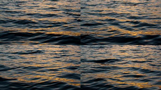 金色湖面夕阳下的水面波浪波光