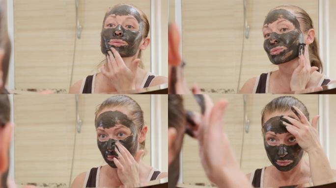 成年妇女在脸上戴黑色复兴面具的肖像