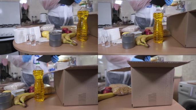 Mercy志愿者男子用手将杂货从桌子上折叠成纸板donat盒子，戴着防护手套，在冠状病毒大流行期间转