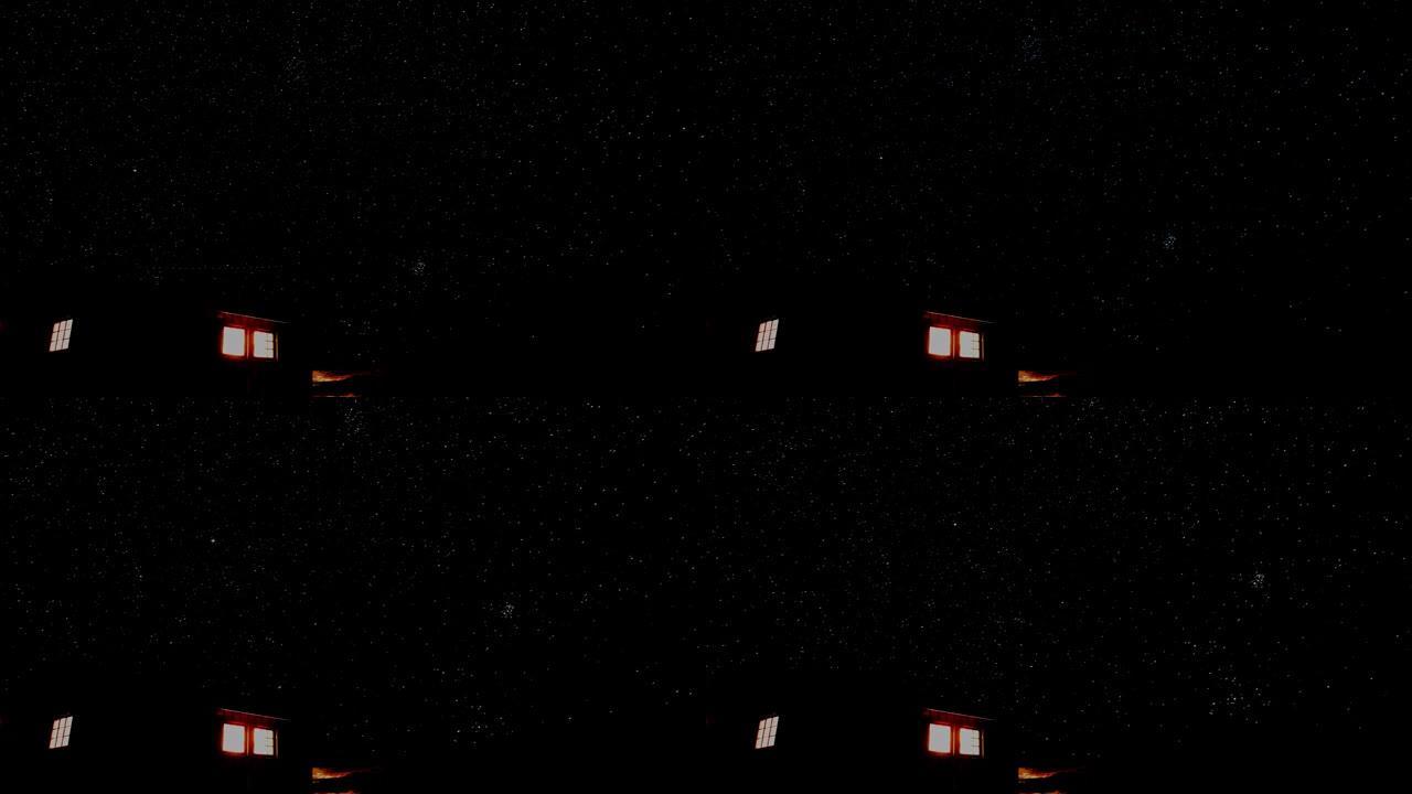 山里的小木屋，窗外闪耀着光芒，背景是繁星点点的夜空。延时视频。