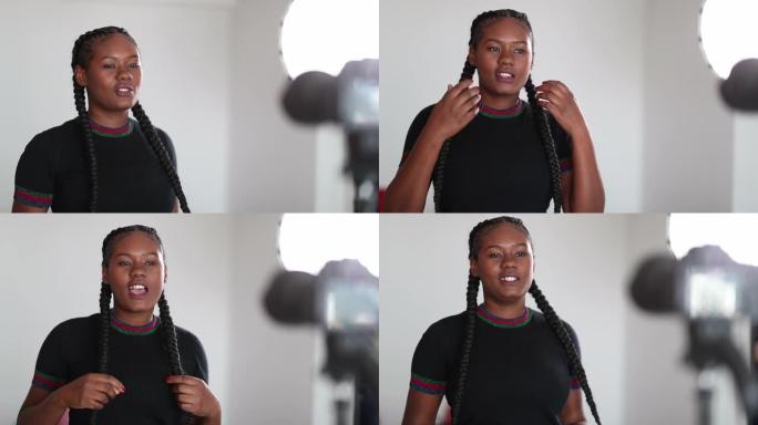 非洲女孩视频记录器在摄像机虚拟观众面前讲话
