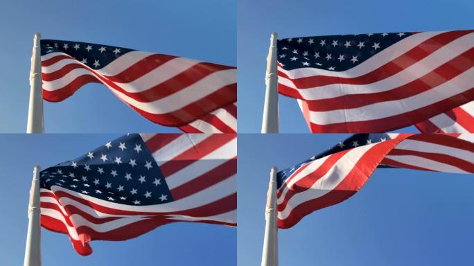 美国国旗在旗杆上飘扬，背面是岩石山