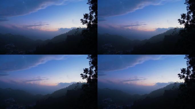 日出前雾蒙蒙的山村的清晨景色