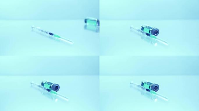 疫苗小瓶与无菌针头注射器。抗冠状病毒疫苗的医学研究开发和生产概念，COVID 19。制药行业的药物和