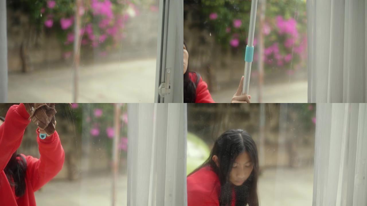 女孩穿着红色毛衣，在外面清洁眼镜窗，生活方式理念。