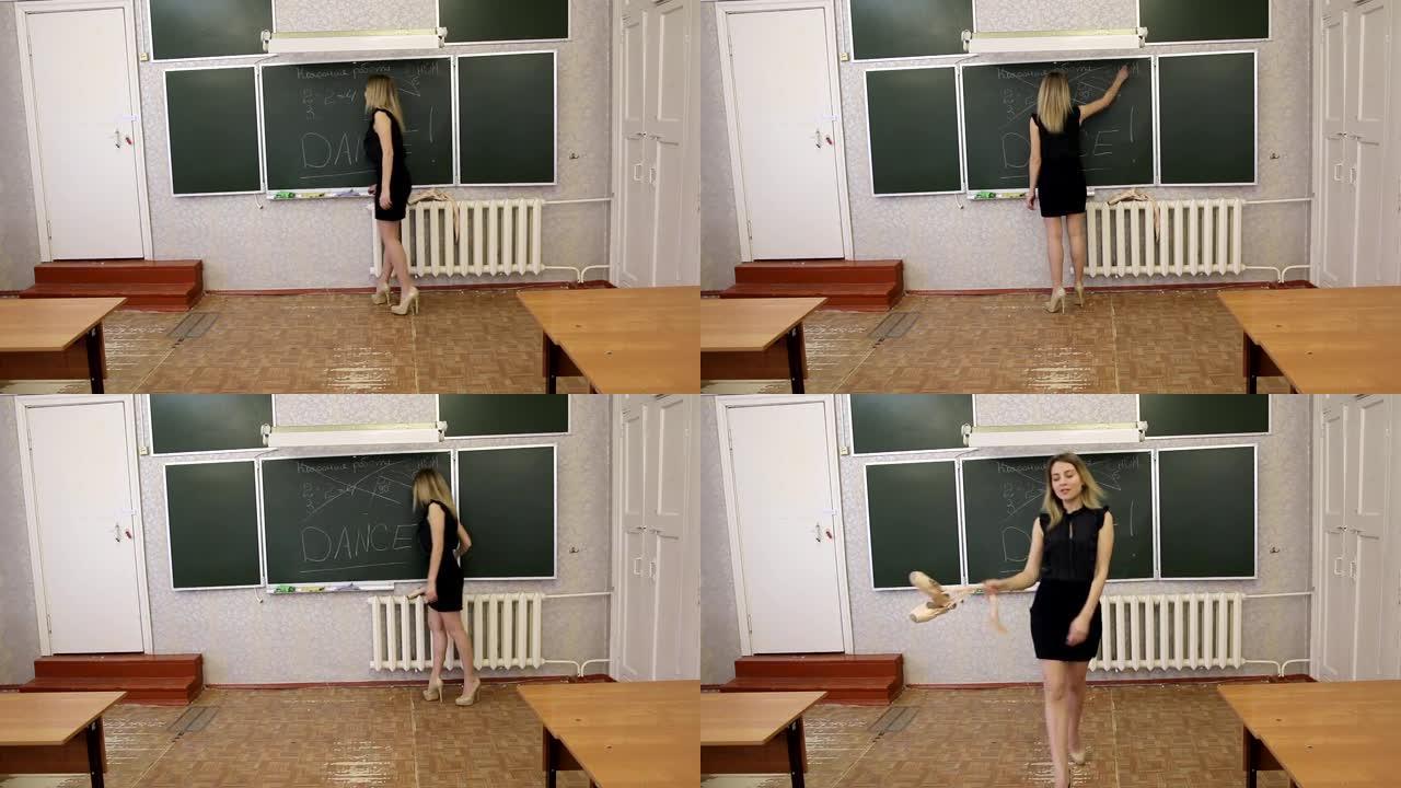 年轻的苗条的coed金发女郎在黑板上交叉着 “在课堂上工作” 的字样，并从观众中捡起脚尖鞋。