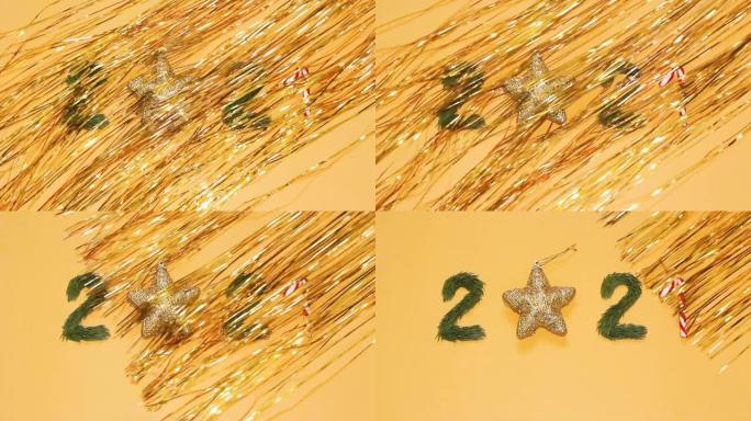 数字2021和金色金属丝条，黄色背景上的节日新年最小概念