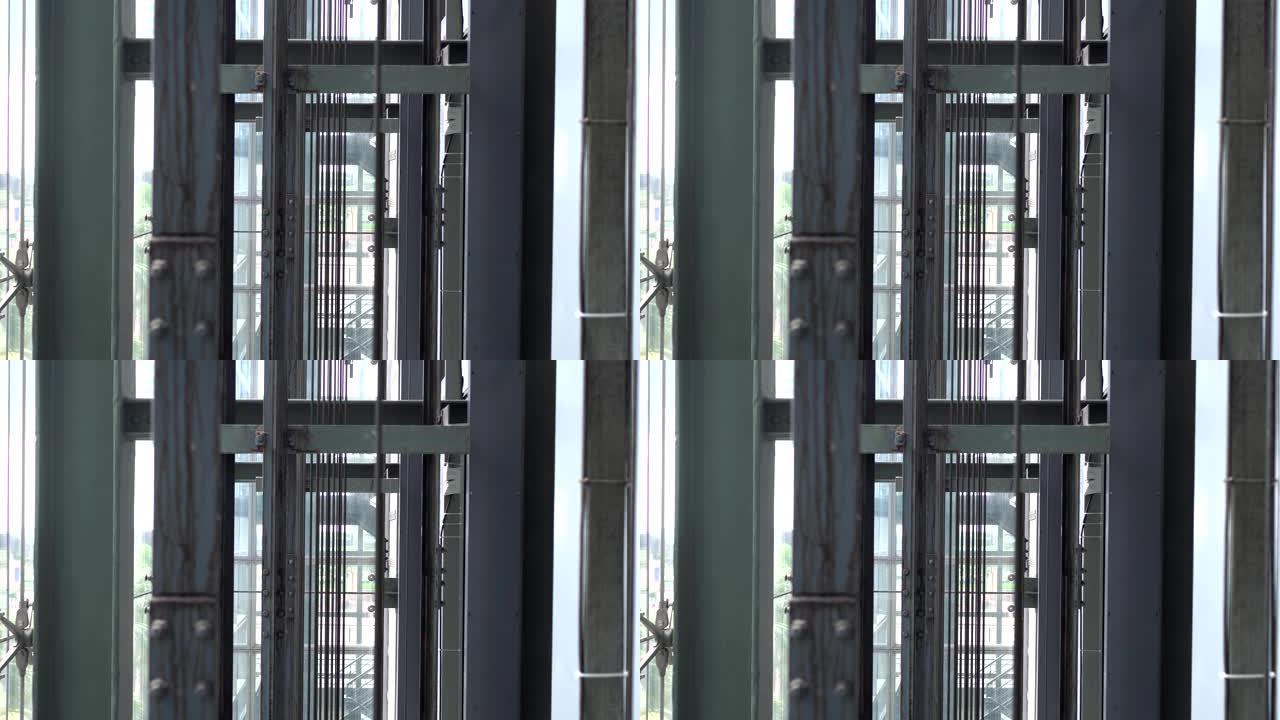 玻璃电梯钢架钢绳特写。