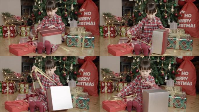 年轻女孩打开圣诞礼品盒