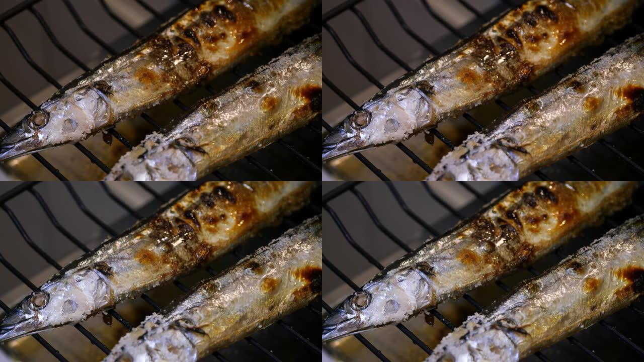 秋季秋刀鱼的特写视频。用烤鱼烤的秋刀鱼。