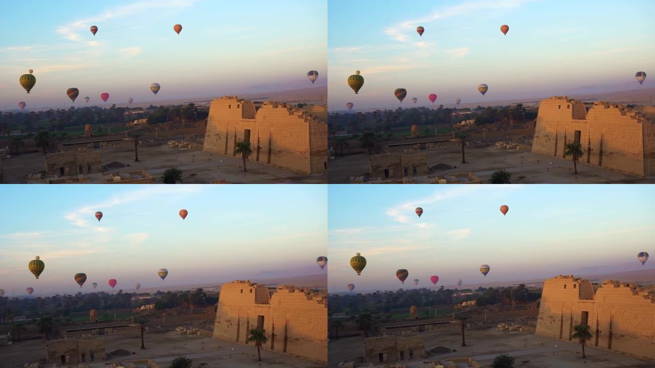 从埃及卢克索国王谷附近的热气球上鸟瞰穿过Medinet Habu神庙