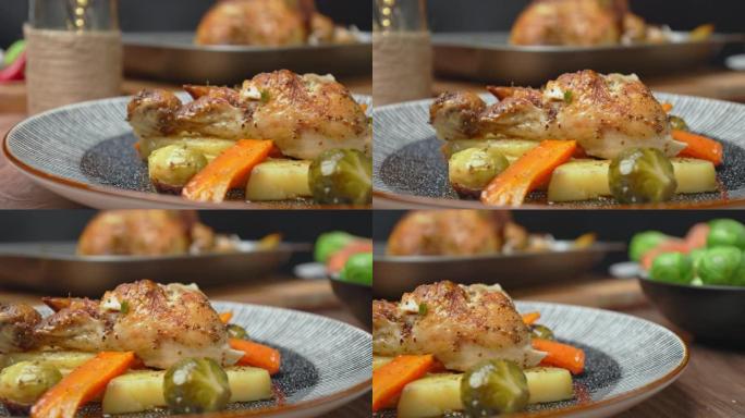 餐盘中新鲜烤鸡和蔬菜的特写镜头。在4k中搭配新鲜制作的鸡肉餐的概念。