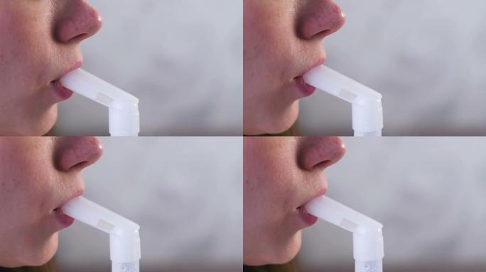 使用雾化器和吸入器进行治疗。年轻女子通过吸入器喷嘴吸入，喉咙坐在沙发上。特写嘴唇和鼻子。
