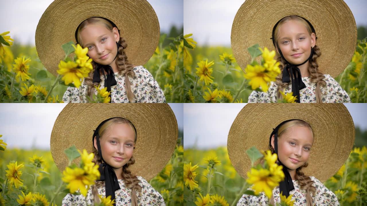 夏天村向日葵田上戴着两根辫子的肖像漂亮女孩。漂亮的乡村女孩，发辫和草帽在黄色向日葵背景上摆姿势。