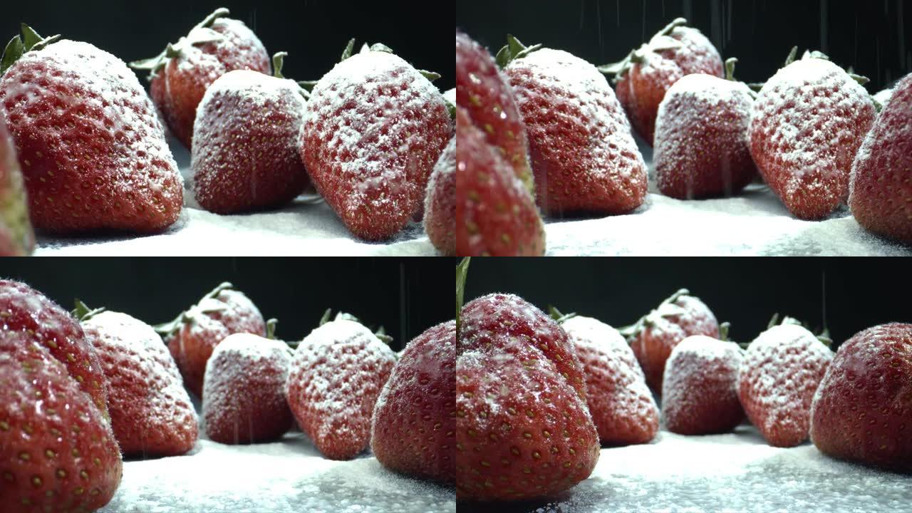 将糖粉撒在草莓上。糖粉草莓。
