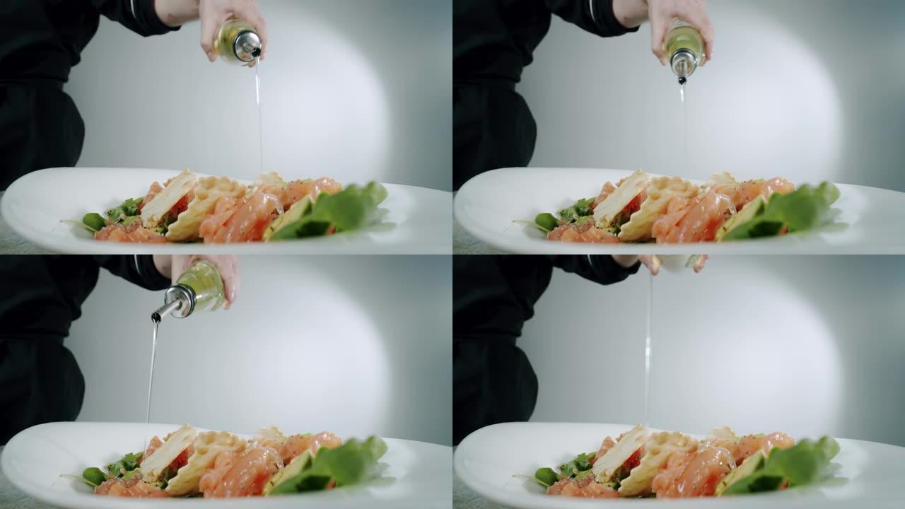 厨师用红鱼浇橄榄油。慢动作