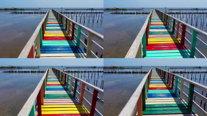 泰国彩虹桥。彩色木桥的景色延伸到泰国samut sakhon省的海中，鸟瞰图。
