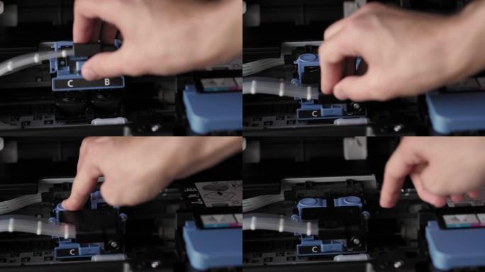 视频指导，技术，媒体，办公室，文具概念-男性手的特写镜头准备新的喷墨打印机。步骤6: 关闭墨盒锁定盖