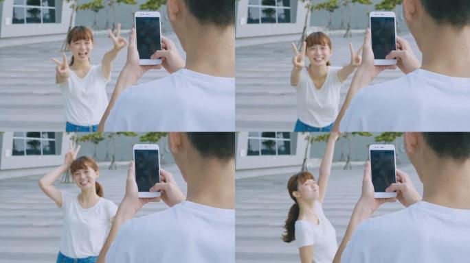 亚洲情侣使用智能手机自拍
