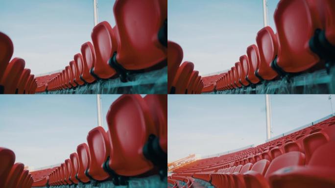 大型体育场的红色椅子看台。