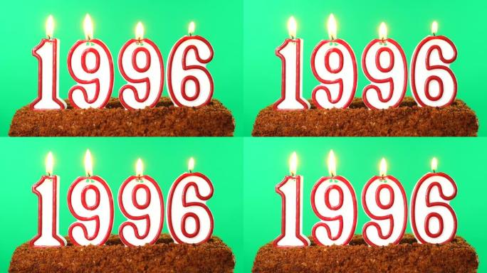 蛋糕与数字1996点燃的蜡烛。上个世纪的日期。色度键。绿屏。隔离