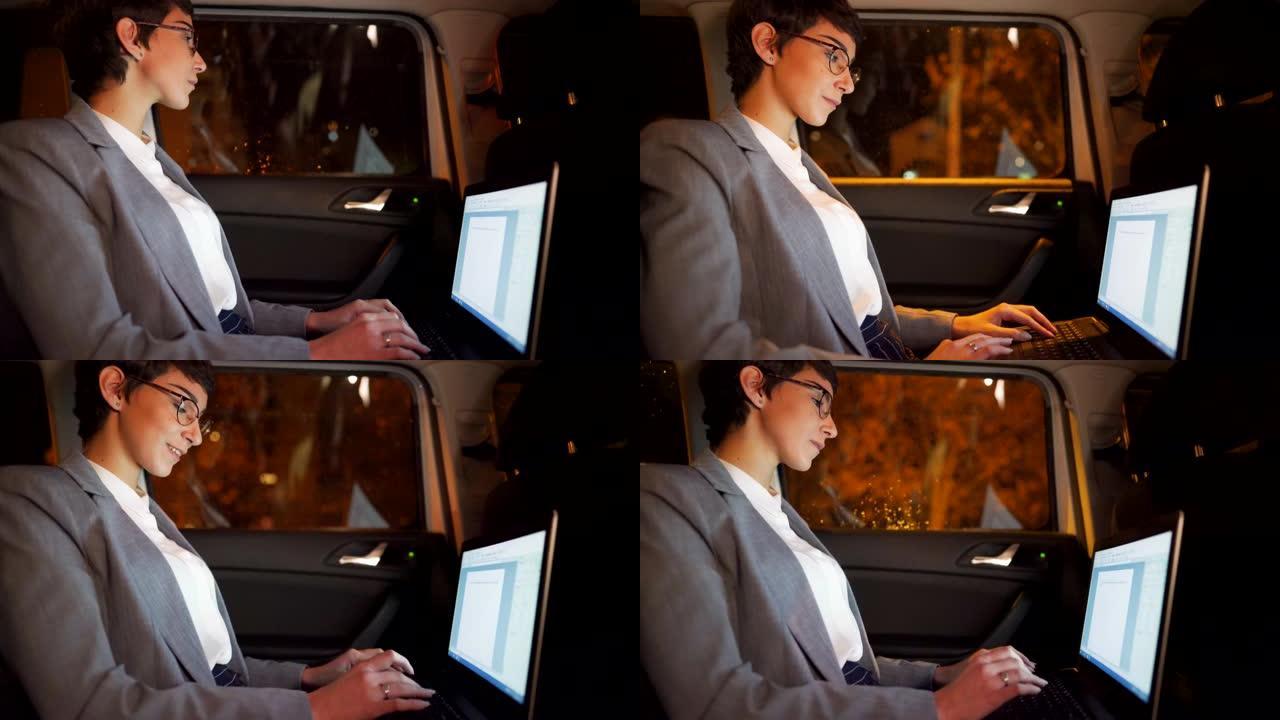 年轻的女商人深夜在汽车上的笔记本电脑上工作