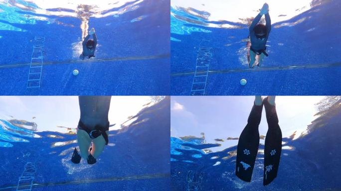 水下底视图倾斜女人穿一件长袖比基尼剪裁潜水服做动态呼吸暂停游泳finning颤振踢与双鳍在游泳池