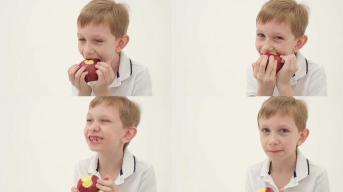 小男孩少了一些牙齿吃红苹果